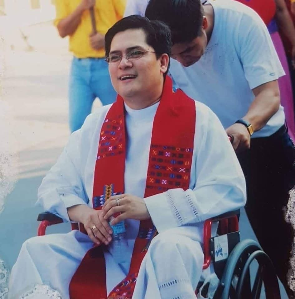 Fr. Arnold Abelardo seated in a wheelchair
